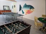 Unleash Your Competitive Spirit in the Game Room - Complete with Foosball, Ping Pong, Poker, and Darts